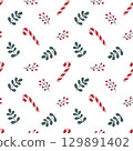 Seamless Christmas pattern with candy canes, peppermint candies, berries, and branches on a white background. 129891402