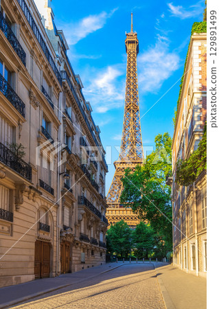 Eiffel Tower, famous landmark of Paris, view from a typical street of France Eiffel Tower, famous landmark of Paris, view from a typical street of France 129891499