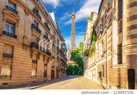 View on the Eiffel Tower from a typical street of France, famous landmark of Paris 129891500