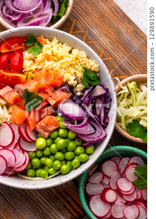 Balanced healthy bowl with vegetables and salmon Balanced healthy bowl with vegetables and salmon 129891590