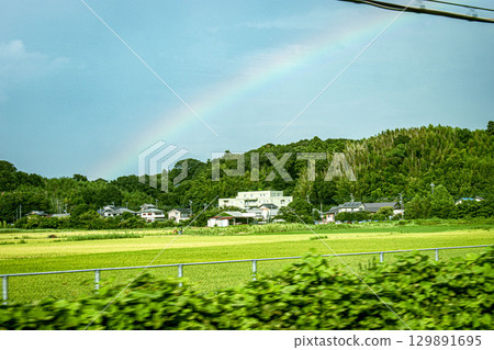 Rainbow over the countryside 129891695