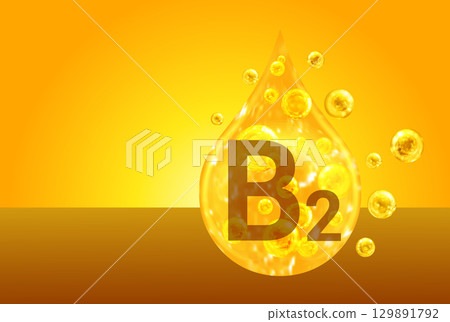 Vitamin B2. Golden drops with oxygen bubbles. Health concept 129891792