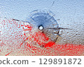 Bullet hole in broken glass and blood 129891872