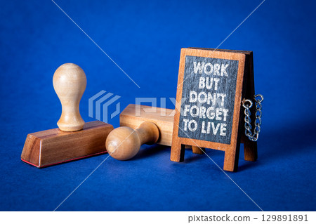Work Life Balance Reminder Message on Chalkboard with Rubber Stamps on Blue Background Work Life Balance Reminder Message on Chalkboard with Rubber Stamps on Blue Background 129891891