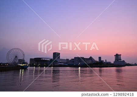 A view of Nagoya Port Building and the Ferris wheel in the morning glow A view of Nagoya Port Building and the Ferris wheel in the morning glow 129892418