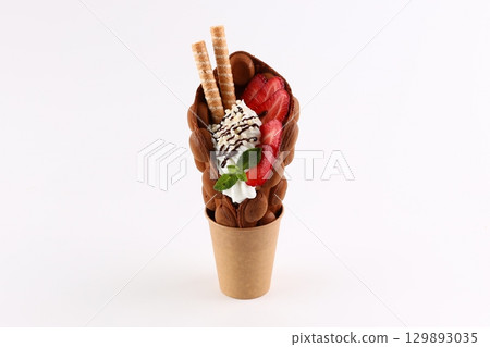 Chocolate Bubble Waffle Cone with Strawberries, Whipped Cream, and Wafer Sticks Chocolate Bubble Waffle Cone with Strawberries, Whipped Cream, and Wafer Sticks 129893035