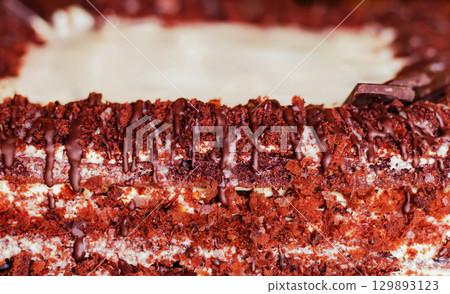 Festive layered chocolate cake with milk cream, dark chocolate cake 129893123