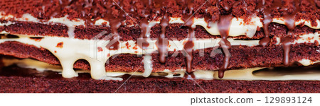 Festive layered chocolate cake with milk cream, dark chocolate cake 129893124