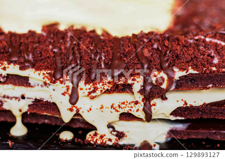 Festive layered chocolate cake with milk cream, dark chocolate cake Festive layered chocolate cake with milk cream, dark chocolate cake 129893127