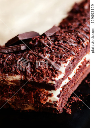 Festive layered chocolate cake with milk cream, dark chocolate cake 129893129
