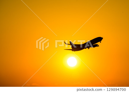 Airplane scenery with a beautiful sunset as a background (copy space material) Airplane scenery with a beautiful sunset as a background (copy space material) 129894700