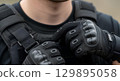 Blank tactical vest strap over shoulder, isolated 129895058