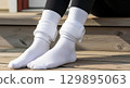 Blank long socks rolled over leggings, mid-calf, isolated 129895063