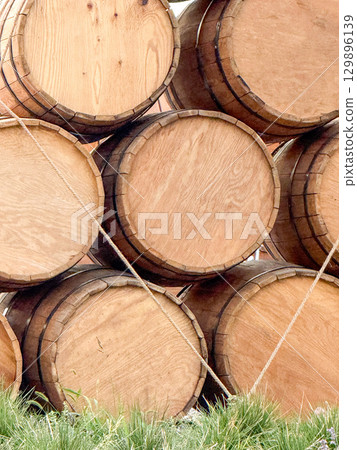Stack of wooden barrels for storage and aging Stack of wooden barrels for storage and aging 129896139