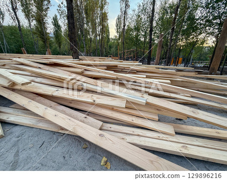 Stack of wooden planks for construction and carpentry Stack of wooden planks for construction and carpentry 129896216