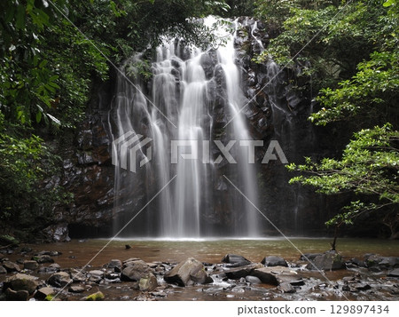 White silk sliding down the rock face - the breath of Ellinjaa Falls White silk sliding down the rock face - the breath of Ellinjaa Falls 129897434