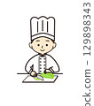 A cook shredding cabbage 129898343