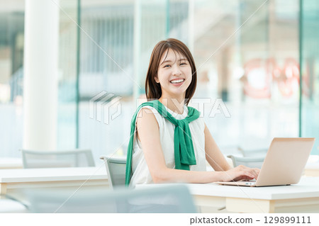A university student operating a computer in a university classroom 129899111
