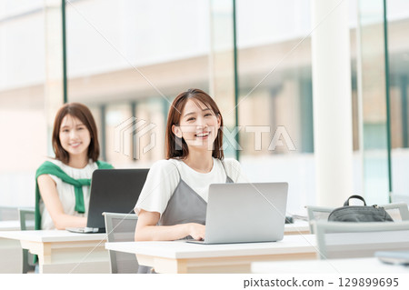 Female college student class computer 129899695