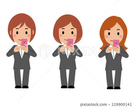 A young woman in a gray suit operating a smartphone 129900141