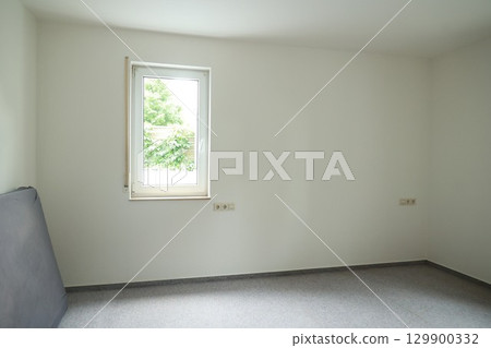 Bedroom with a window and a bed 129900332