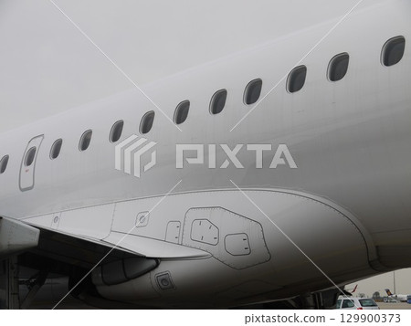 The airplane is white and has a lot of windows The airplane is white and has a lot of windows 129900373