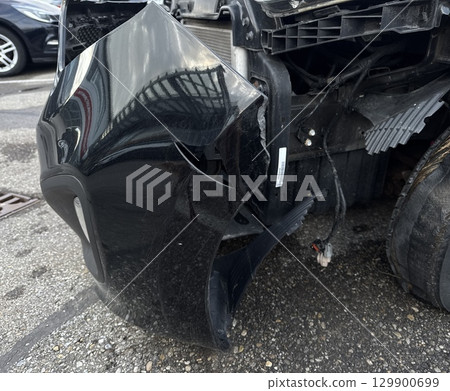 Black car with a smashed front end Black car with a smashed front end 129900699
