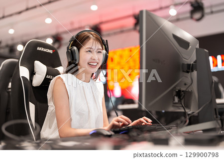 Young woman enjoying e-sports games Young woman enjoying e-sports games 129900798