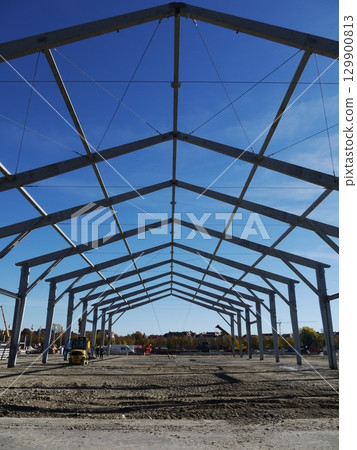 Large building with a blue sky in the background 129900813