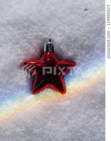 Red star is on top of a white snow Red star is on top of a white snow 129900823