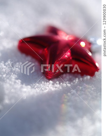 Red star is on top of a snowy surface Red star is on top of a snowy surface 129900830