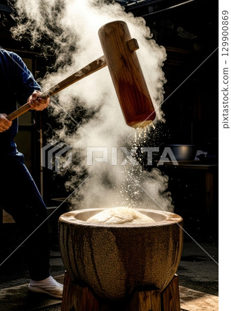 Traditional Japanese mochi pounding scene 129900869