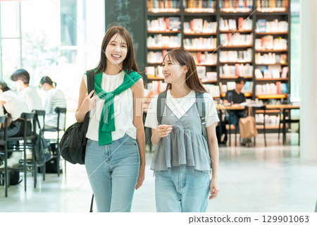 Young female college student shopping 129901063