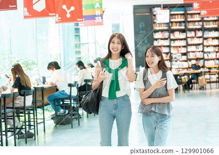 Young female college student shopping Young female college student shopping 129901066