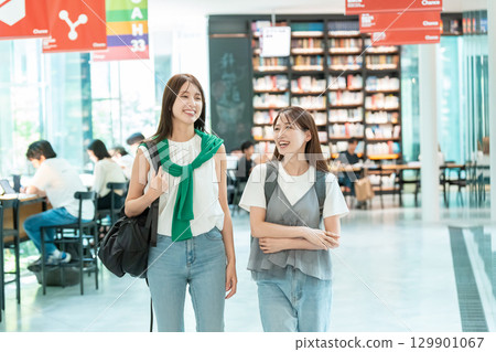 Young female college student shopping 129901067