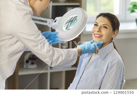 Patient face examination by professional dermatologist to check for skin problem, therapy results Patient face examination by professional dermatologist to check for skin problem, therapy results 129901550