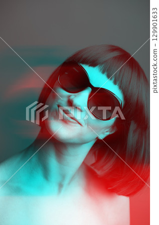 Close-up portrait of beautiful woman with wig and sunglasses in RGB color split effect style Close-up portrait of beautiful woman with wig and sunglasses in RGB color split effect style 129901633