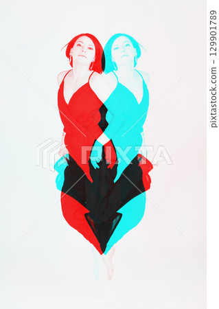 Happy woman with black clothes jumping to air Happy woman with black clothes jumping to air 129901789