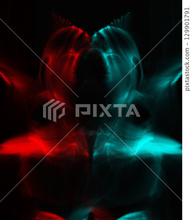 Light trails of light painting vivid color woman portrait 129901791