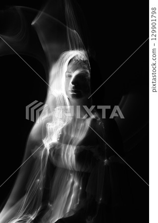 Abstract human silhouette in light trails of light painting 129901798