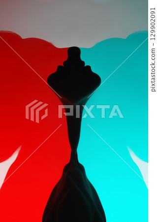 Woman black face silhouette with flying hairs in red and blue color effect Woman black face silhouette with flying hairs in red and blue color effect 129902091