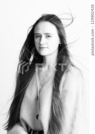 Beautiful long hair brunette woman studio portrait in white background 129902426