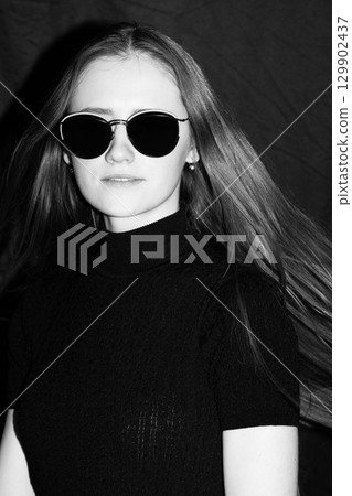 Brunette beautiful woman close-up portrait with sunglasses 129902437