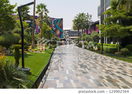 Vibrant Park and Modern Streetscape with Mural in Boulevard, Riyadh. Vibrant Park and Modern Streetscape with Mural in Boulevard, Riyadh. 129902564