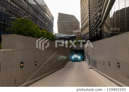 Car Emerging from an Underground Parking Garage in a Modern City. KAFD. KSA 129902585