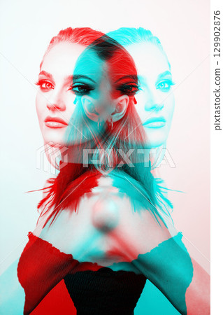 Beautiful woman with smokey makeup close up studio portrait in RGB color split effect 129902876