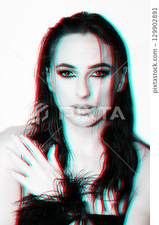 Beautiful woman with smokey makeup close up studio portrait in RGB color split effect Beautiful woman with smokey makeup close up studio portrait in RGB color split effect 129902891
