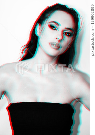 Beautiful woman with smokey make-up close up studio portrait in RGB color split effect 129902899