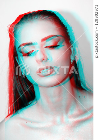 Beautiful woman with smokey make-up close-up studio portrait in RGB color split effect 129902973