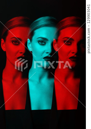 Beautiful woman with classic hairstyle and suit close-up studio portrait in RGB color split effect 129903041